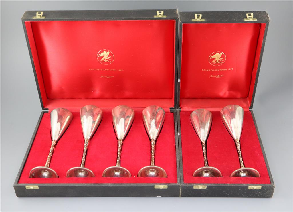 A set of six modern Stewart Devlin parcel gilt silver goblets (Senior Falcon Award 1979 & 1980) in two fitted cases (4 & 2),